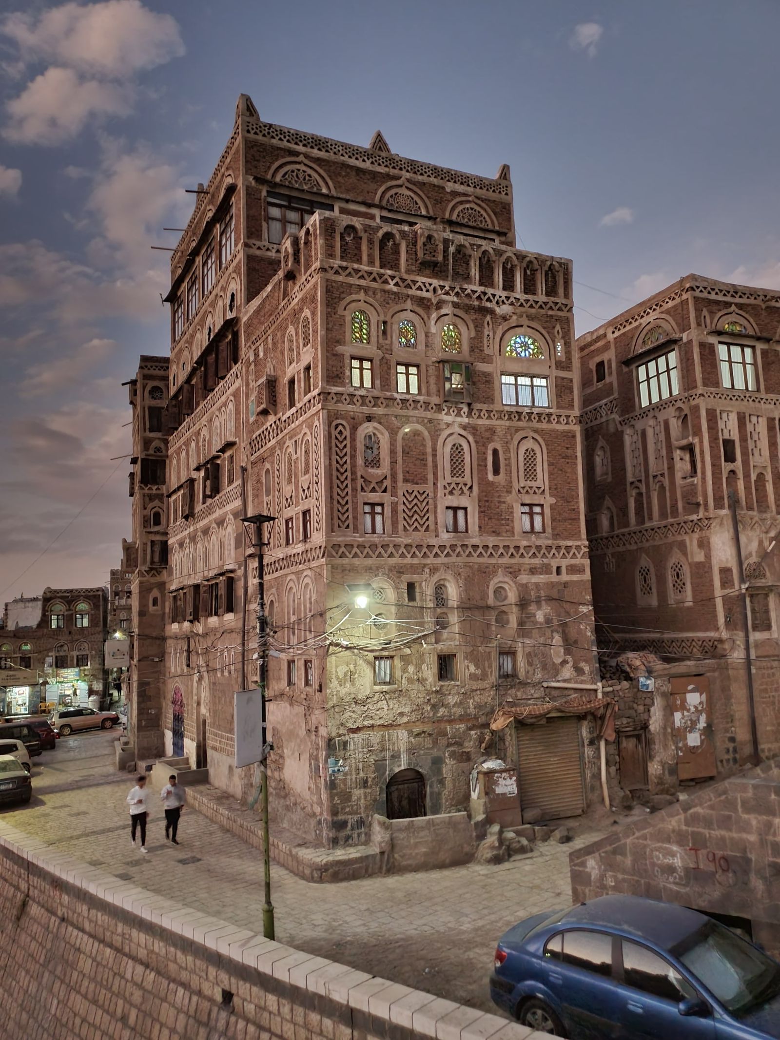 Tall traditional tower houses of brick and white-painted stone in Sanaa's Old City.