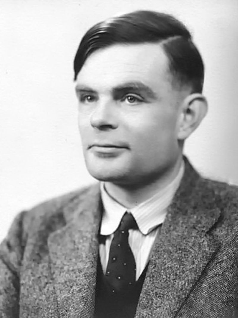 Alan Turing in a suit and tie, photographed in 1951
