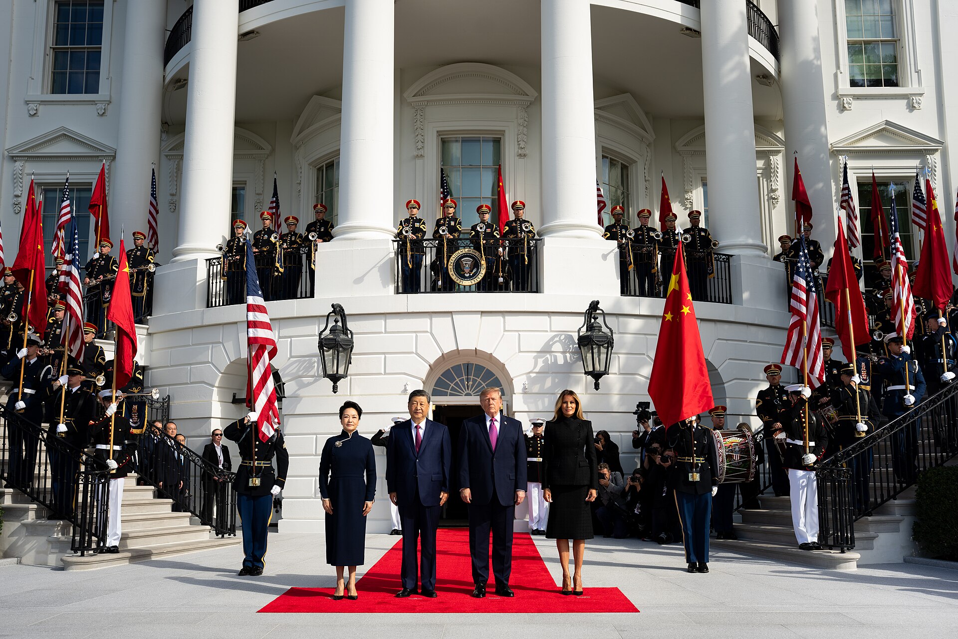 Donald Trump and Melania Trump greet Xi Jinping and Peng Liyuan at the White House South Portico