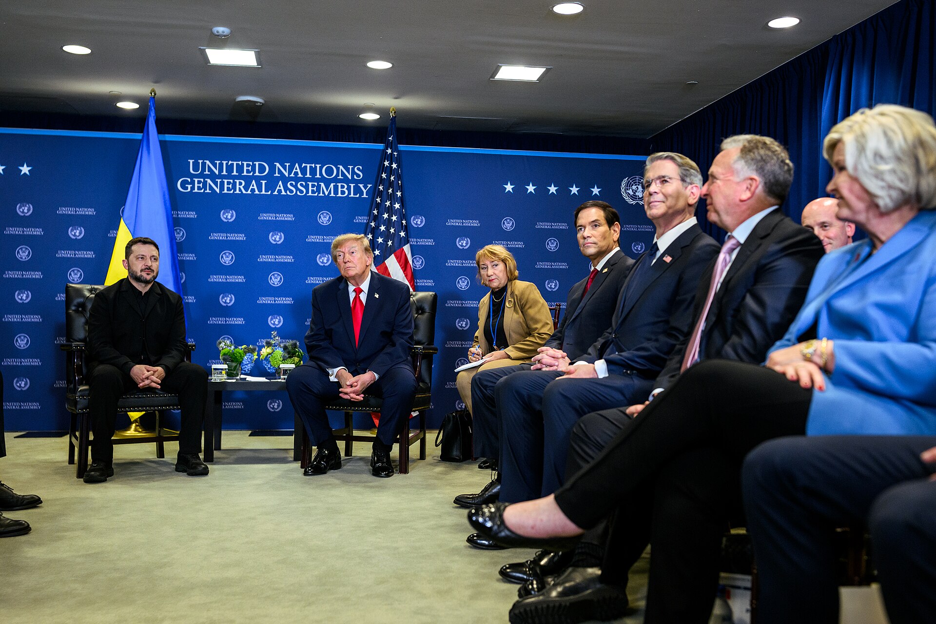 Donald Trump and Volodymyr Zelensky seated with their delegations at a meeting in New York