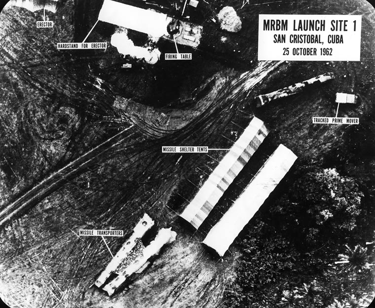 Black-and-white American reconnaissance photograph of Soviet medium-range missile launch site 1 at San Cristóbal, Cuba, with labels marking missile shelter tents and transporters, 25 October 1962.