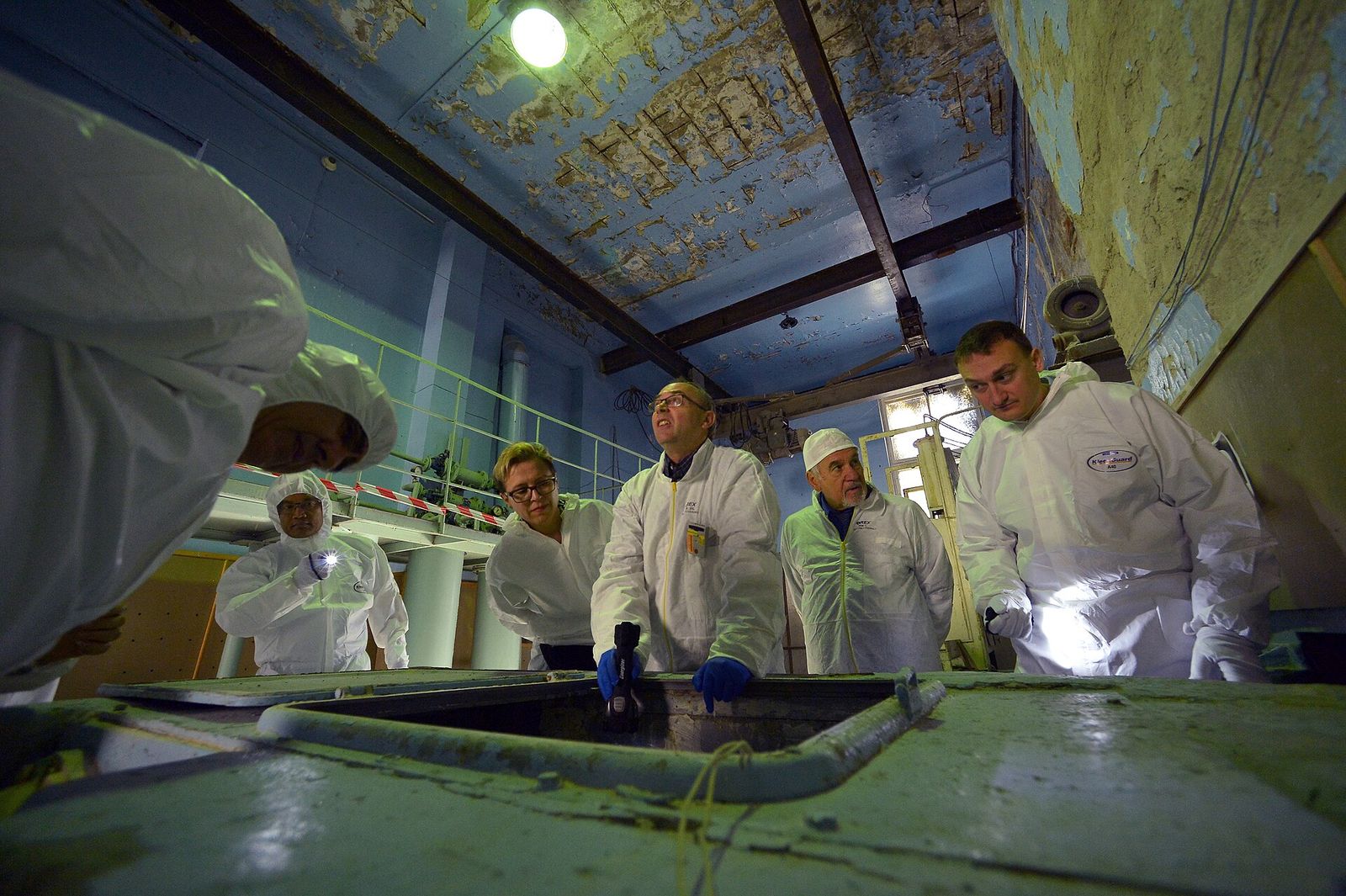 IAEA safeguards inspectors in protective clothing at a training facility
